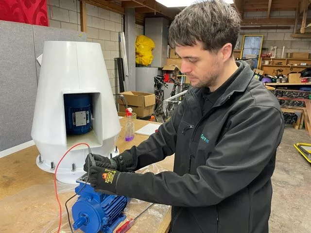 Technician servicing a laboratory machine